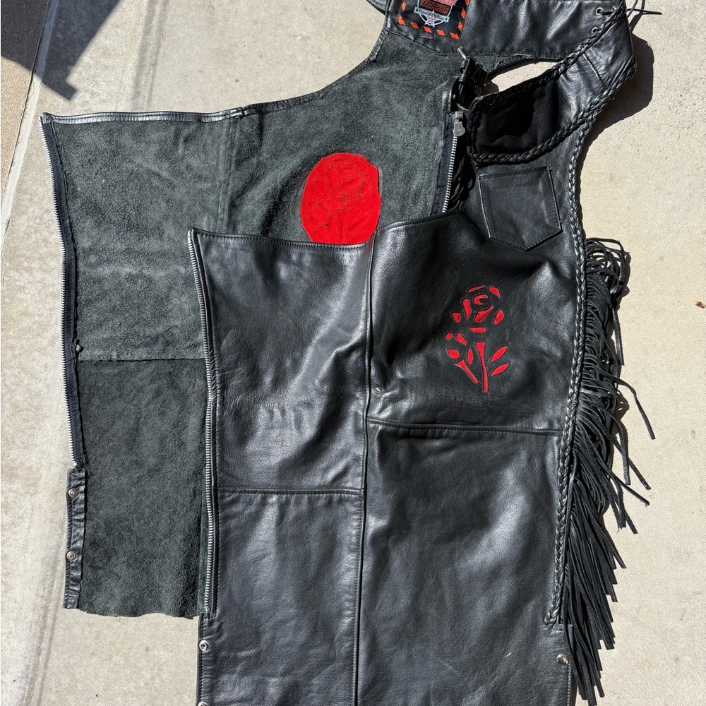 Harley Davidson Black Leather chaps with fringe and red rose accents.